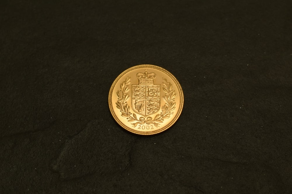 A 2002 Queen Elizabeth II Gold Sovereign, Shield of Arms, Royal Mint: A 2002 Queen Elizabeth II Gold Sovereign, Shield of Arms, Royal Mint