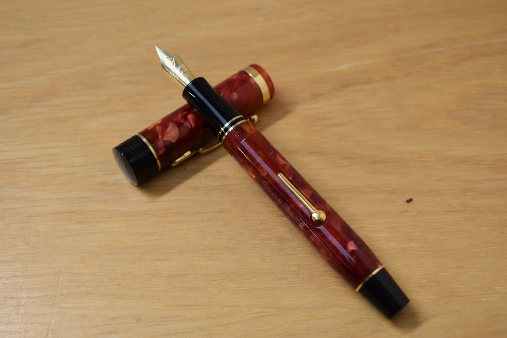 A Presentation boxed Conway Stewart Churchill lever fill fountain pen in cherry red with (1 of 3)