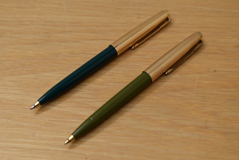 Two Parker 45 ballpoint pens in sage and dark green with gold filled caps: Two Parker 45 ballpoint pens in sage and dark green with gold filled caps