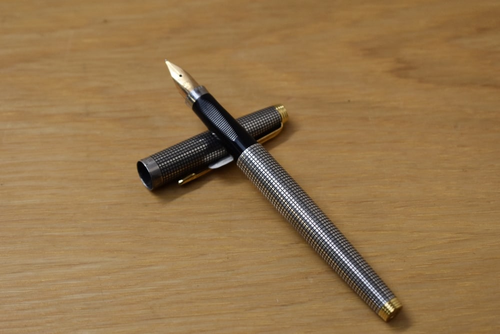 A boxed Parker 75 Cicele cartridge fill fountain pen in sterling silver with gold trim having Parker (1 of 3)
