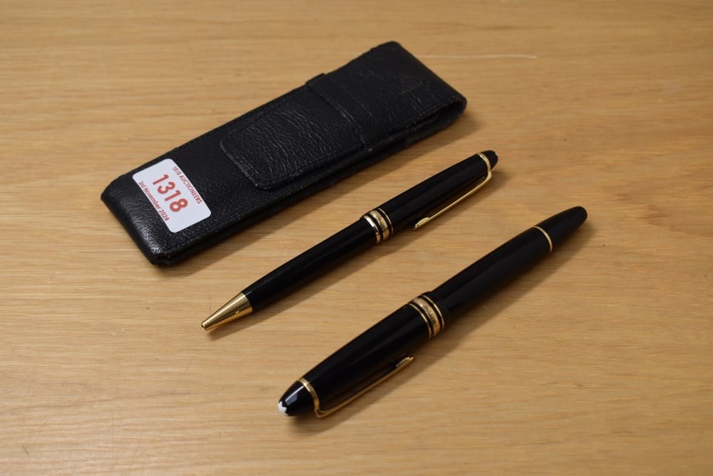 A Montblanc Meisterstuck 146 piston fill fountain pen and ballpoint pen in black with gold trim (1 of 3)