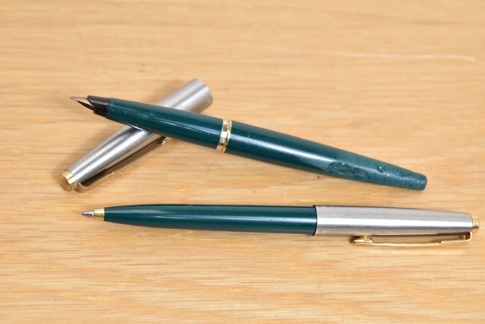 A Parker 45 converter fill fountain pen and ballpoint pen in green having a lutraloy cap with gold (1 of 2)