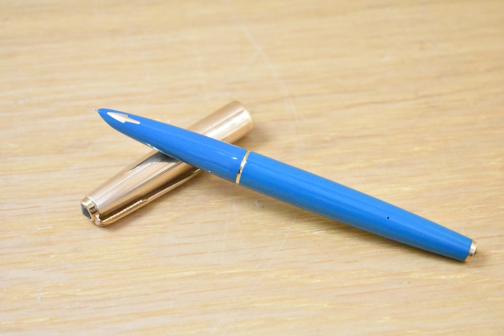 A Parker Custom Insignia capillary fill fountain pen in turquiose with rolled gold cap: A Parker Custom Insignia capillary fill fountain pen in turquiose with rolled gold cap