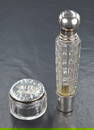 A French silver mounted cut glass scent bottle, of fluted form having a removable silver base and
