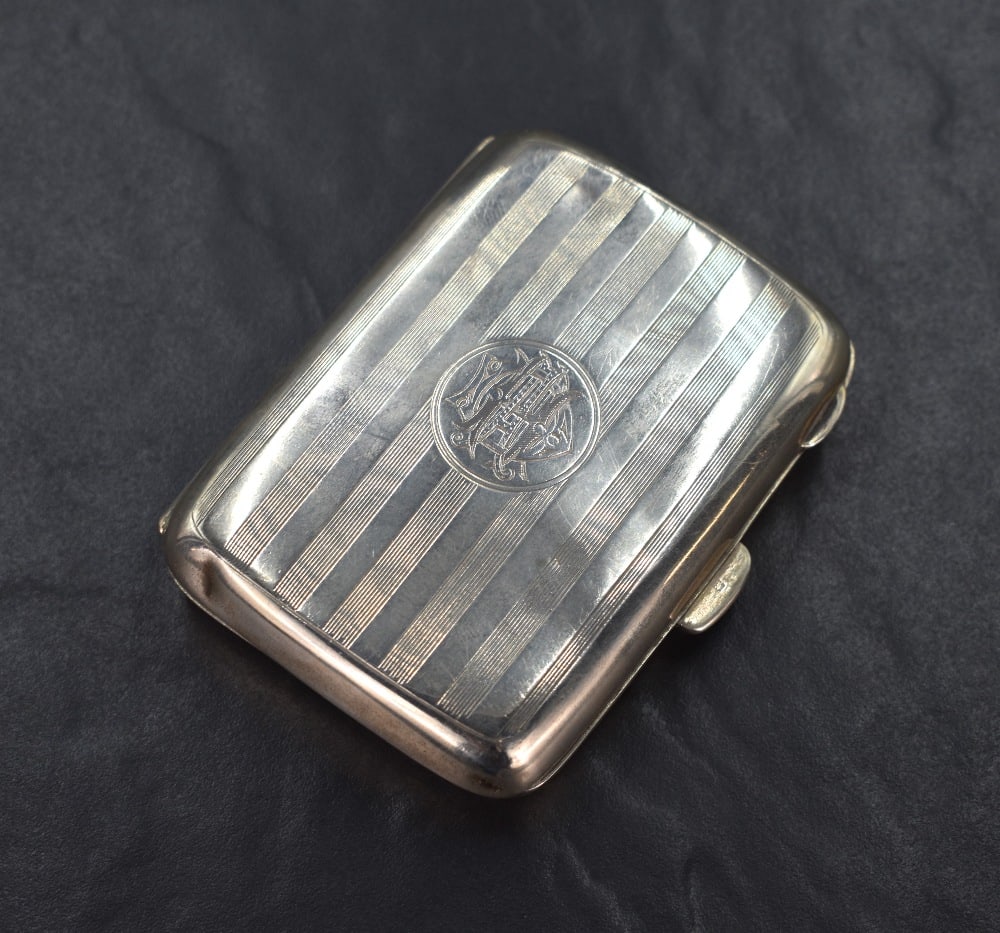 A George V silver cigarette case of hinged rectangular form slightly curved for the gentleman's (1 of 5)