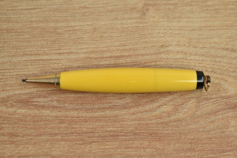 A Parker Duofold torpedo vest pocket propelling pencil in Mandarin Yellow with ring top (1 of 3)