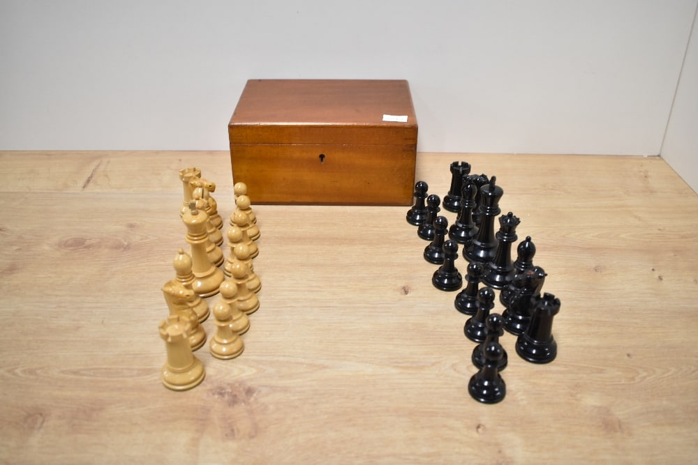 A J Jaques & Son Ltd Staunton Chessmen Boxwood and Ebony Chess Set, in original mahogany box with: A J Jaques & Son Ltd Staunton Chessmen Boxwood and Ebony Chess Set, in original mahogany box with label inside, height of king 9cm, slight damage to white King, white and black Kings both marked J