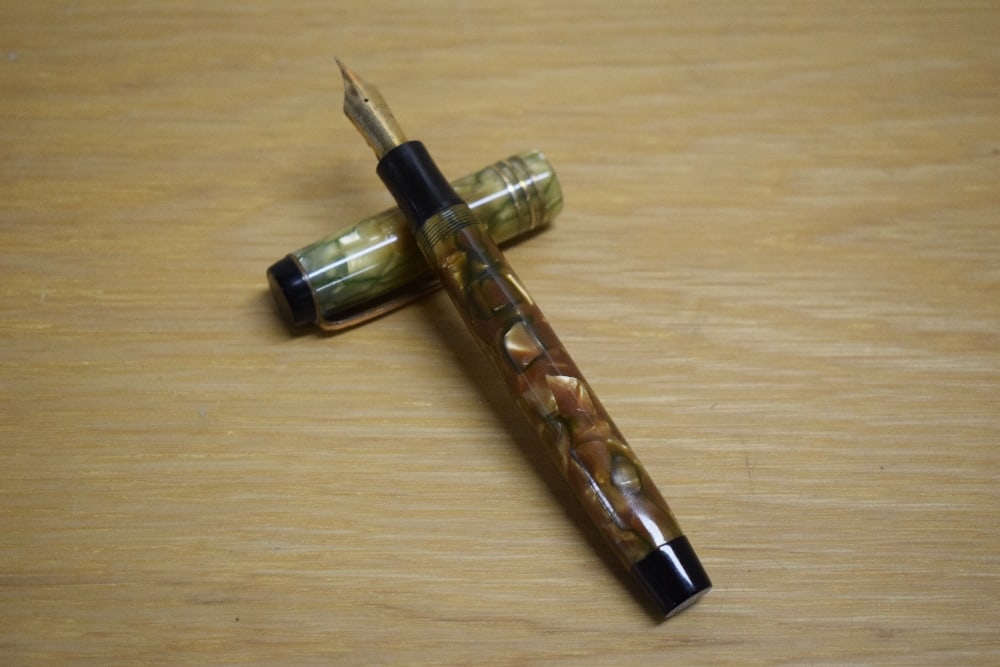 A Parker Duofold Deluxe Special button fill fountain pen in bronze and gold with three cap bands (1 of 3)