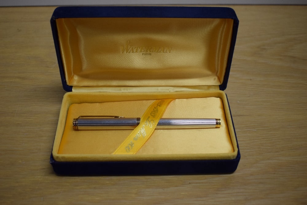 A Waterman Le Man 100 converter/ cartridge in sterling silver fluted design with gold trim having (1 of 3)