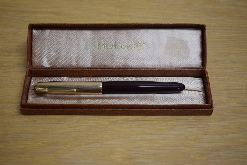 A boxed Parker 51 MKII aerometric fill fountain pen in dark maroon with rolled gold cap (1 of 3)