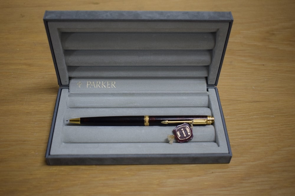 A boxed Parker Premier propelling pencil in brown Chinese Laque: A boxed Parker Premier propelling pencil in brown Chinese Laque