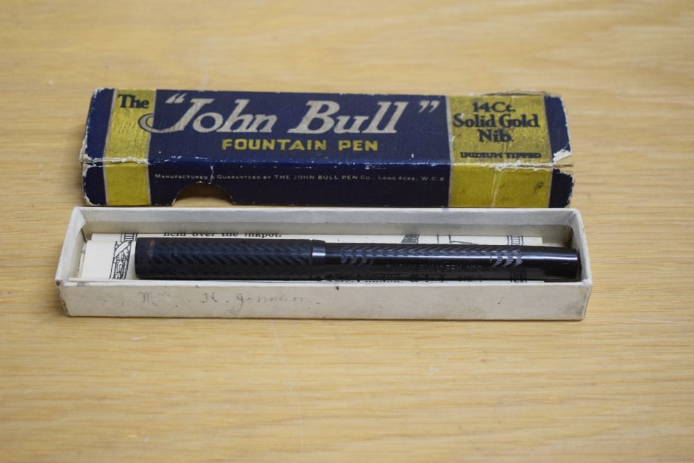 A boxed John Bull No2 lever fill fountain pen in BHT with chaised design having a warrented 14ct 1st: A boxed John Bull No2 lever fill fountain pen in BHT with chaised design having a warrented 14ct 1st Quality nib. In original box which is a bit worn with papers