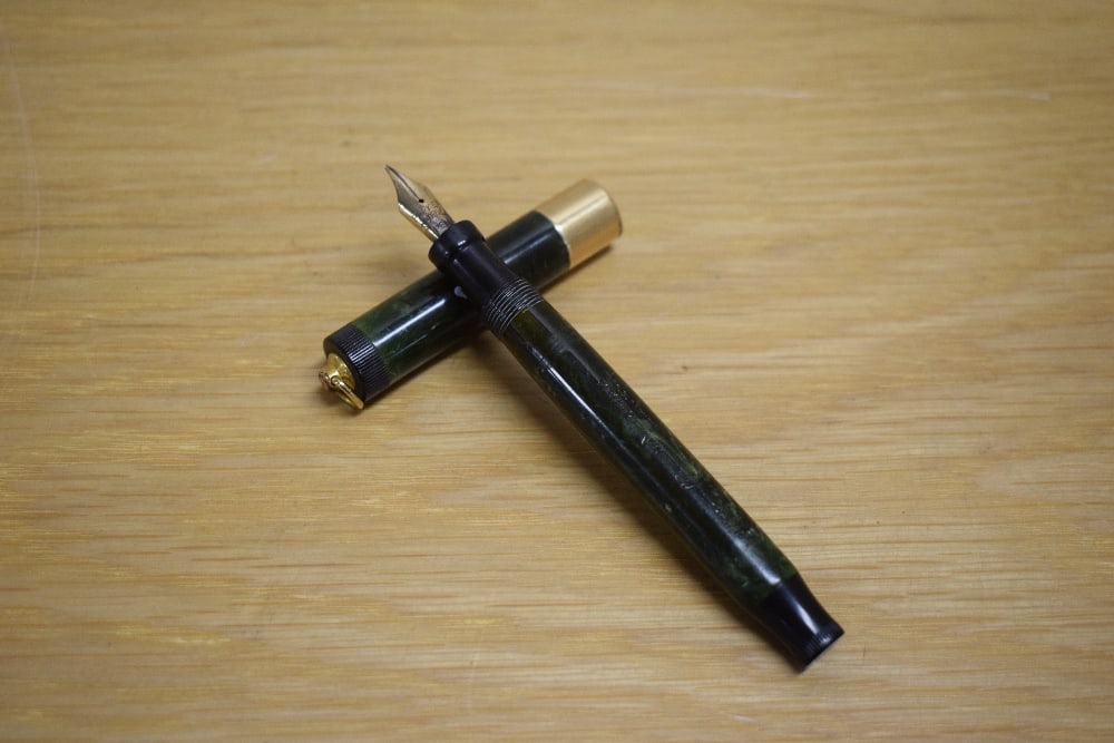 A Parker Duofold Lady Lucky Curve button fill fountain pen in jade green with a broad gold band to (1 of 3)