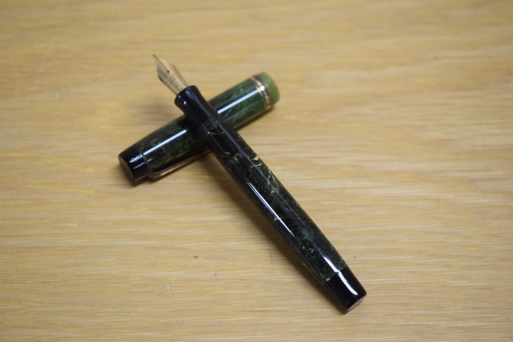 A Parker Duofold Lady button fill fountain pen in jade green with three gold bands to the cap having (1 of 3)