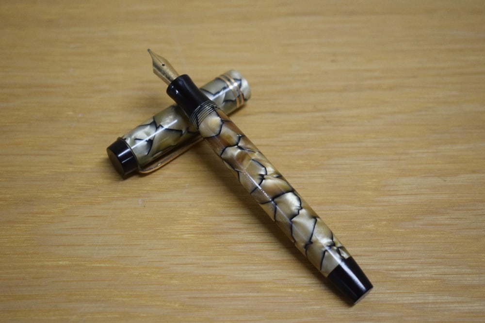 A Parker Duofold Special button fill fountain pen in black and pearl with two gold bands to the (1 of 3)