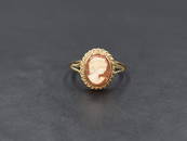 A 9ct gold cameo ring, the bezel set cameo depicting a maiden in profile with a twisted rope mount