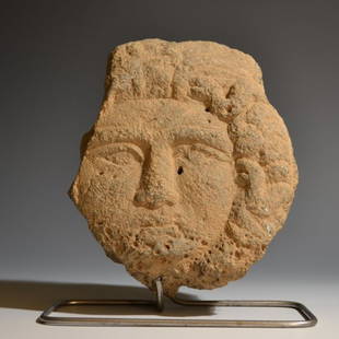 AN ARCHAIC ETRUSCAN NENFRON HEAD OF MEDUSA: AN ARCHAIC ETRUSCAN NENFRON HEAD OF MEDUSA Etruscan / 6th Century B.C. / Nenfro