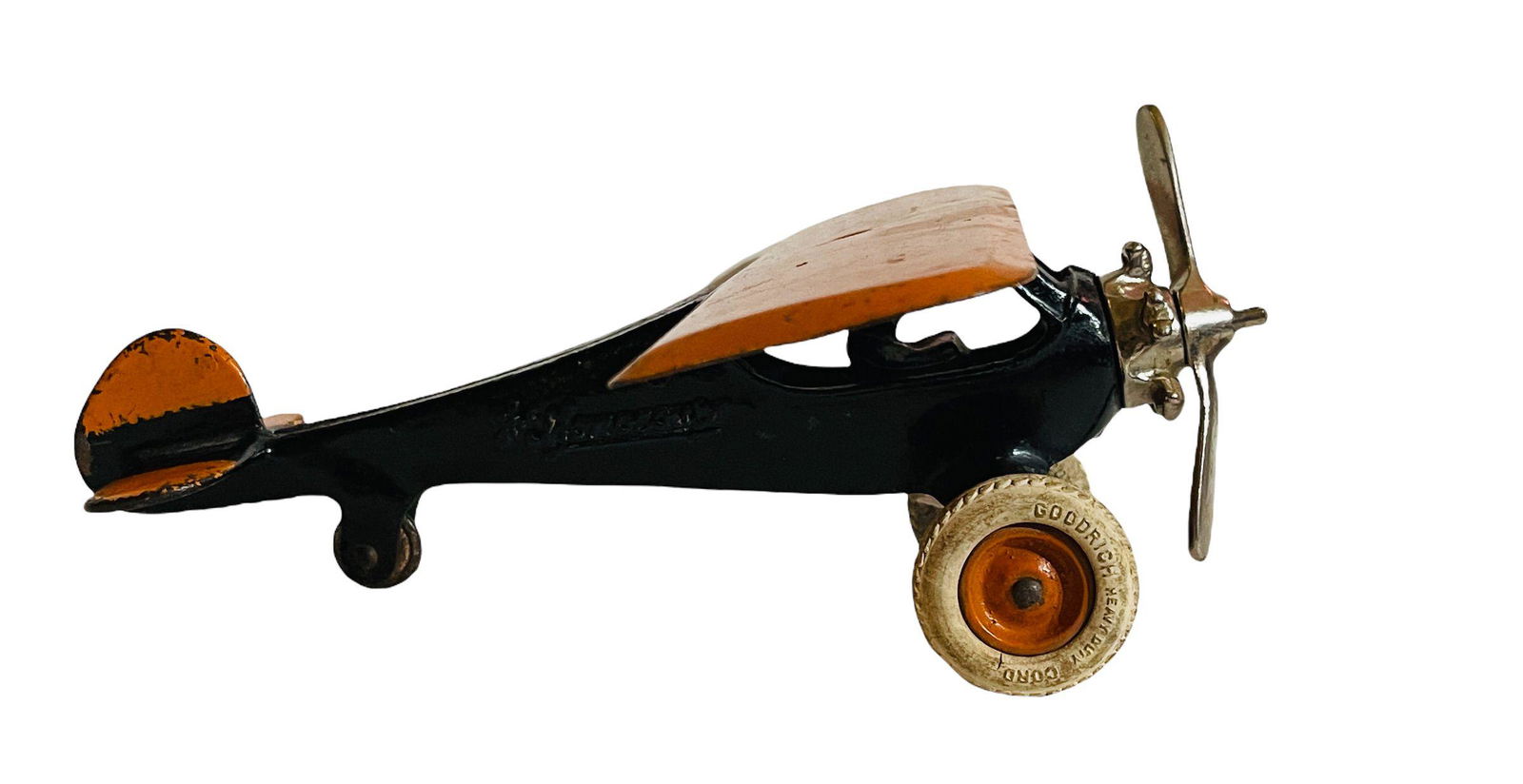 Cast Iron Monocoupe Plane: 10' Long with 10 3/4" Wingspan - Excellent Origin: Freeport, IL Manufacturer: Arcade Mfg. Co. Material: Cast Iron & Steel Period: 1933