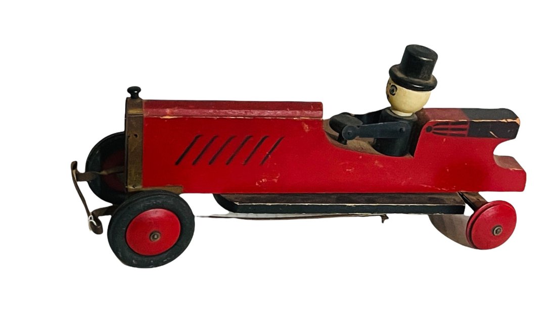 Wood Man Driving a Car - 1930's: 14" Long - Lacks Rear Rubber Tires Origin: Illinois Manufacturer: Hustler Toys Material: Wood & Rubber Period: 1930's