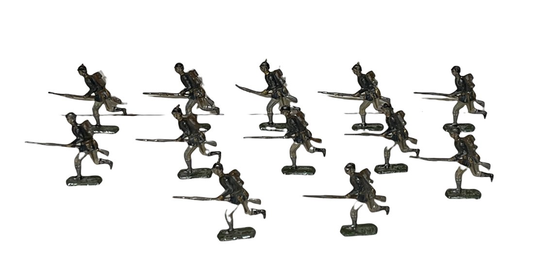 Twelve German Cast Lead Flat Running Infantrymen (1 of 2)