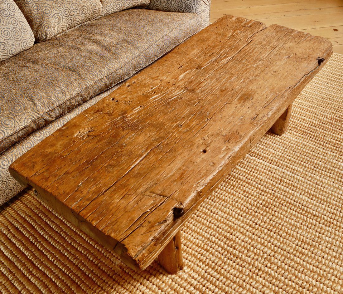 Old Hollywood Western Movie Door / Coffee Table Conversion: Stylish wooden coffee table made with a door used in a Hollywood Western Movie. The eye bolts are still attached and carved writing can be seen on bottom side. We were told the door was from one of th