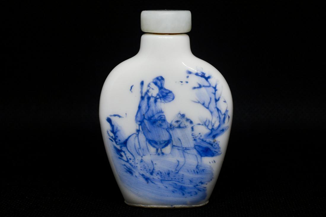 A Blue and White Glaze Porcelain Snuff Bottle: A Blue and White Glaze Porcelain Snuff Bottle with depictions of a man riding a horse. From a dealer in Jacksonville, Oregon.