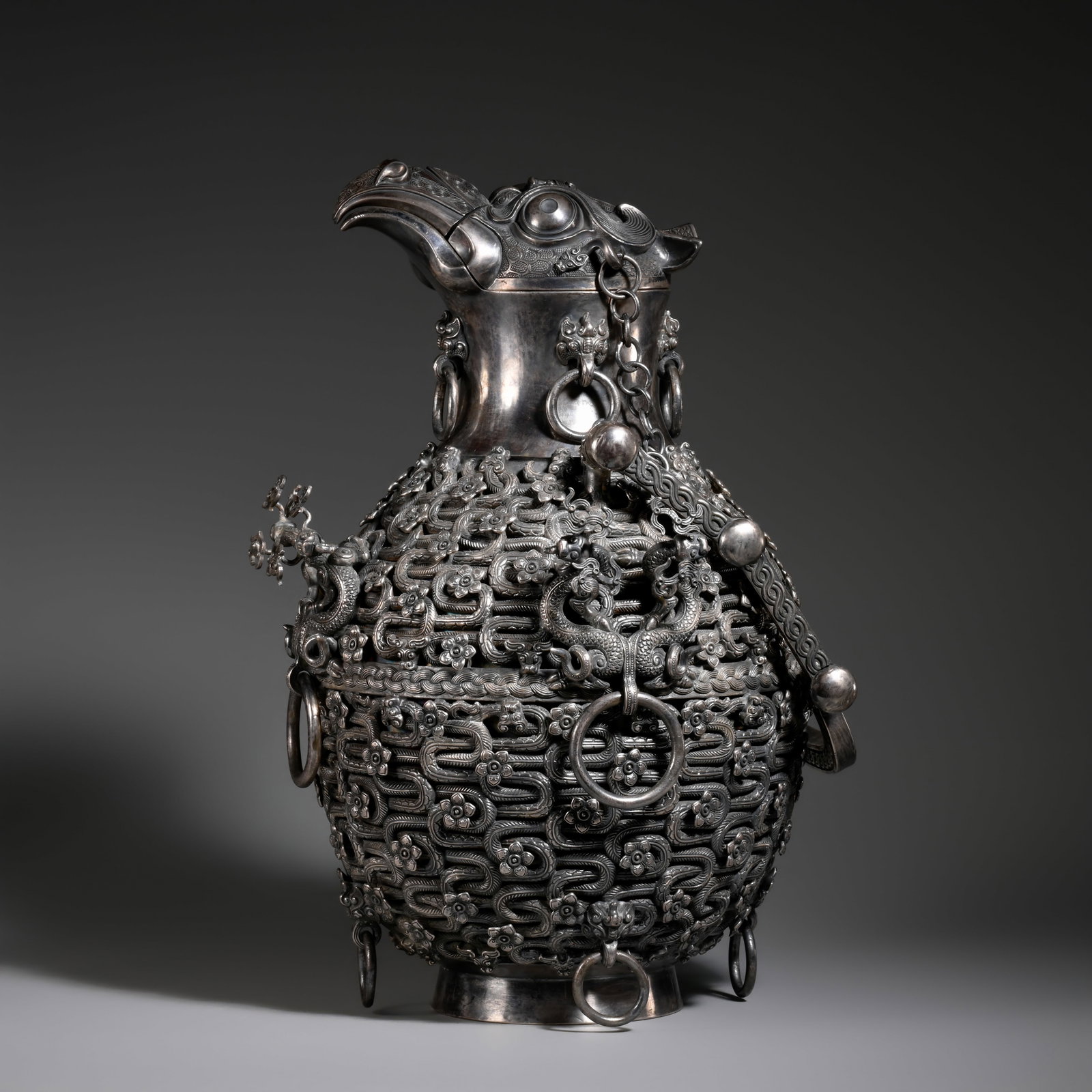 Pre-Ming Dynasty Silver Carved Openwork Dragon and Phoenix Pattern Bird-Head Ring-Handled Covered: H. 29 cm .W. 22cm .weight. 5946 grams