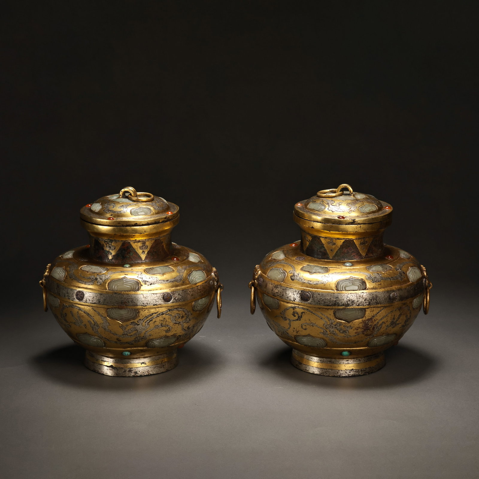 Pair of Pre-Ming Dynasty Gilt-Bronze Jade-Inlaid Covered Jars: H. 19cm.W.19cm.weight. 5143grams