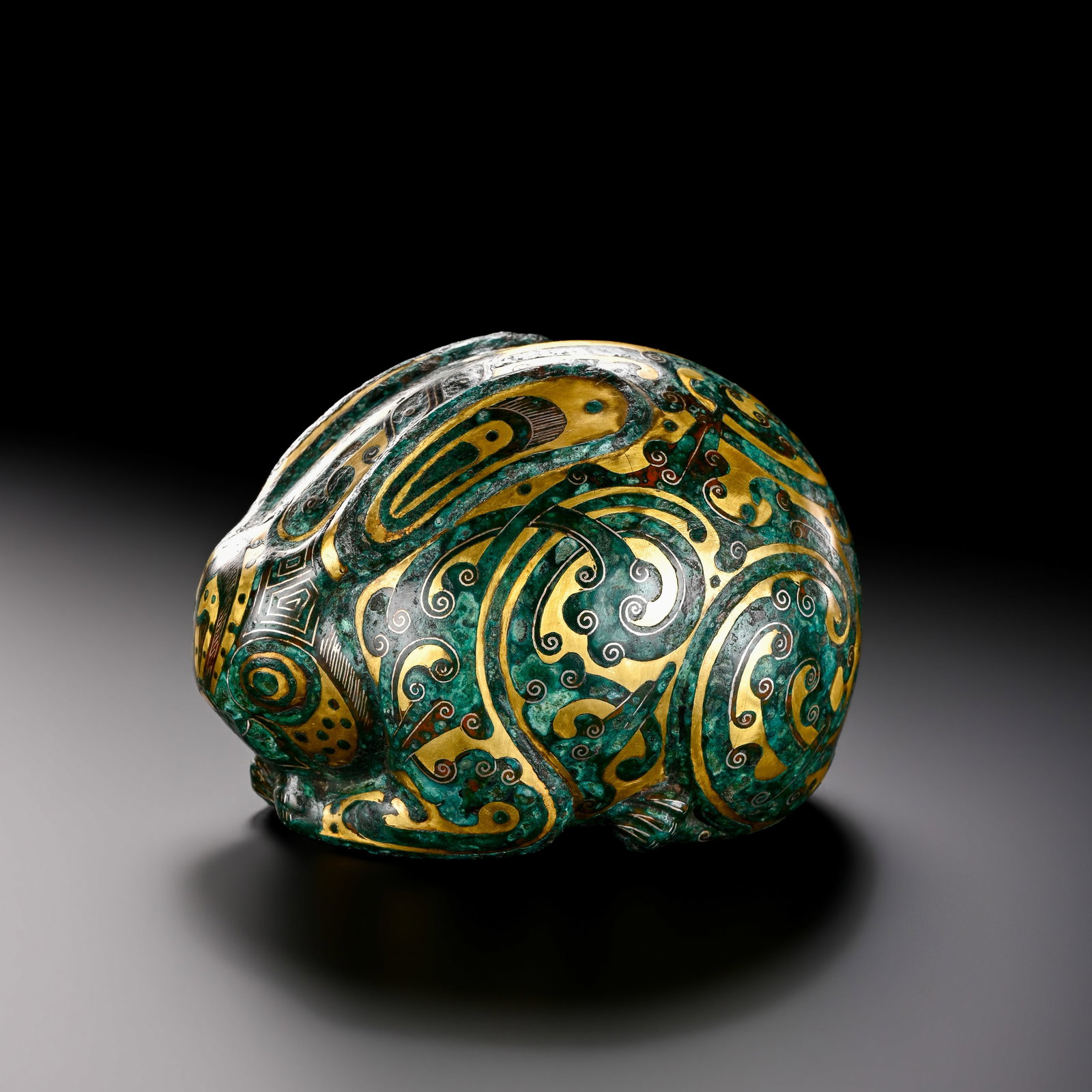 Pre-Ming Dynasty Gold and Silver Inlaid Rabbit Ornament: H. 6cm.W. 8.5cm.weight. 280grams