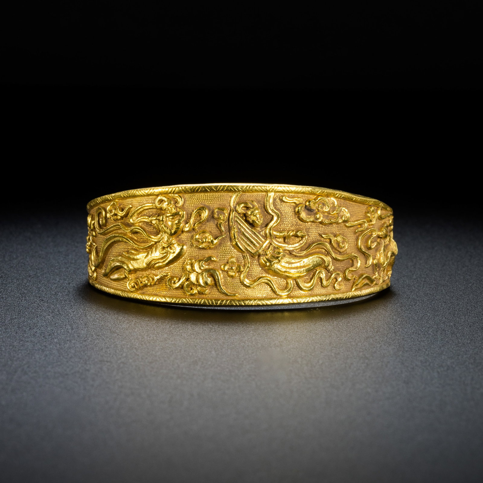 Pre-Ming Dynasty Gold Repoussé Flying Apsaras Gold Bracelet: H. 2.5cm.W.6.5cm.weight.77grams