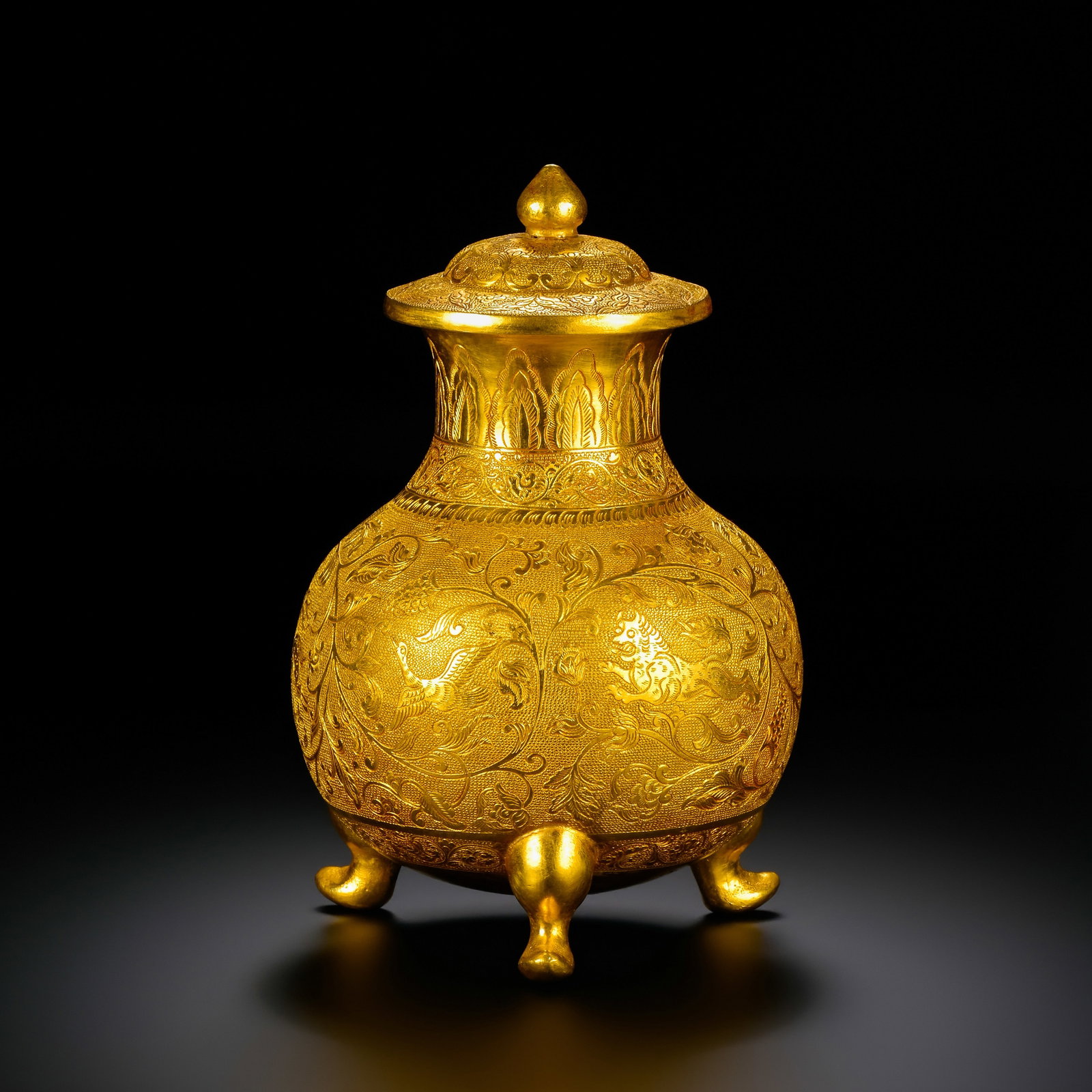 Pre-Ming Dynasty Gold Repoussé Auspicious Beast and Interlocking Floral Three-Legged Covered Jar: H. 12cm.W.8cm.weight.240grams