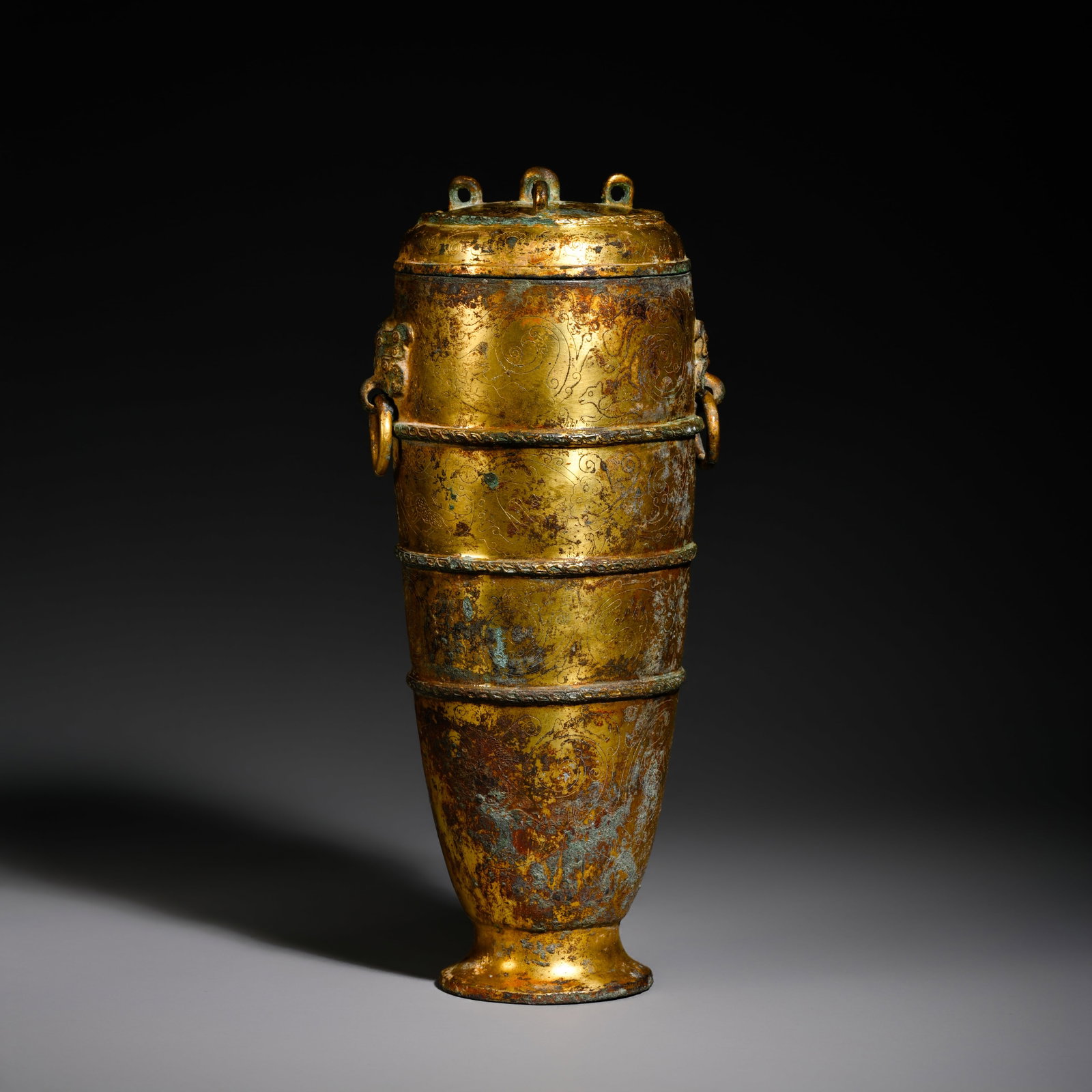 Pre-Ming Dynasty Gilt-Bronze String-Pattern Ring-Handled Covered Ewer: H. 25cm.W.11cm.weight.1278grams