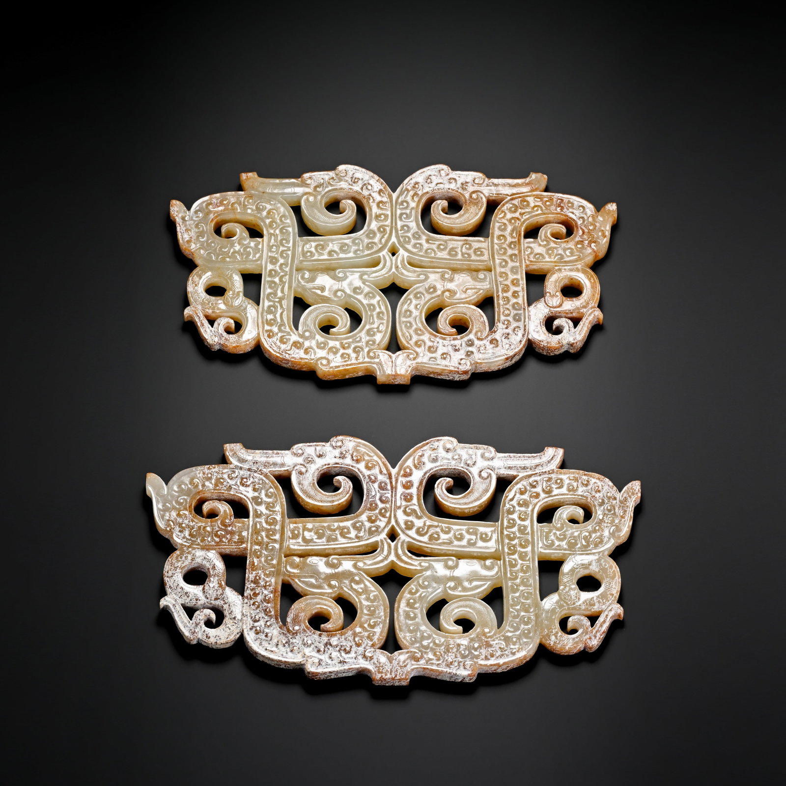 Pair of Pre-Ming Dynasty Openwork Double Dragon Pattern Jade Pendants: H. 7cm.W. 13cm.weight. 168 grams