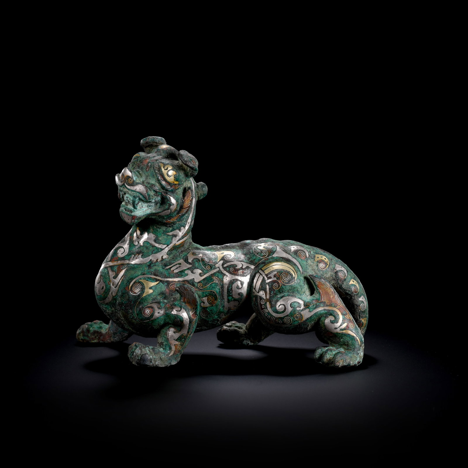 Pre-Ming Dynasty Gold and Silver Inlaid Auspicious Beast Ornament: H. 11cm.W.16cm.weight.990grams
