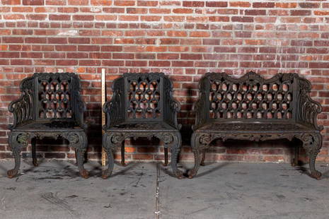 Victorian Three Pierce Cast Iron Garden Bench and Chair Set: Circa late 19th to early 20th century Victorian three piece cast iron garden set consisting of two armchairs and a single bench in the Rococo Revival style with cabriole legs and scrolled foliage moti