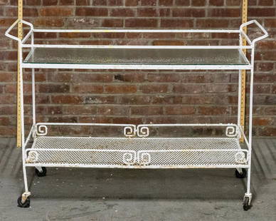 Vintage Russell Woodard Wrought Iron Serving Cart: Vintage Russell Woodard wrought iron serving cart or bar cart on castors in a white painted finish with two handles, glass tabletop, and a bottom wrought iron shelf with Greek key gallery and pierced