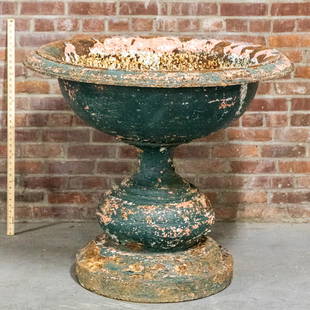 19th Century Cast Iron Large Garden Urn: Circa 19th century large cast iron garden urn on bun shaped base. Please note of wear consistent with age including patina and heavy oxidation. The piece measures 46"DIA x 36"H.