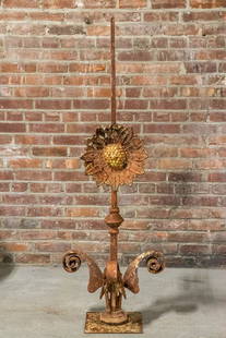 19th Century Iron Sunflower Roof Spire or Finial: Circa 19th century iron sunflower shaped roof spire or pointed finial with scrolled leaves and layered petals. Please note of wear consistent with age including heavy oxidation and patina due to