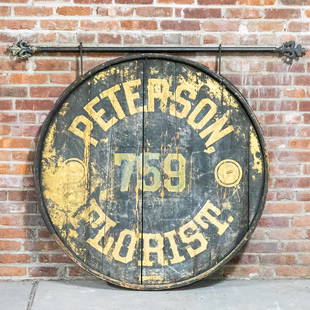 19th Century Two-Sided Florist Trade Sign on Iron Rod: Circa 19th century round painted two sided Florist trade sign hanging on a large iron rod. The sign reads"Peterson Florist." With the number 759 and features original black paint with accents of two