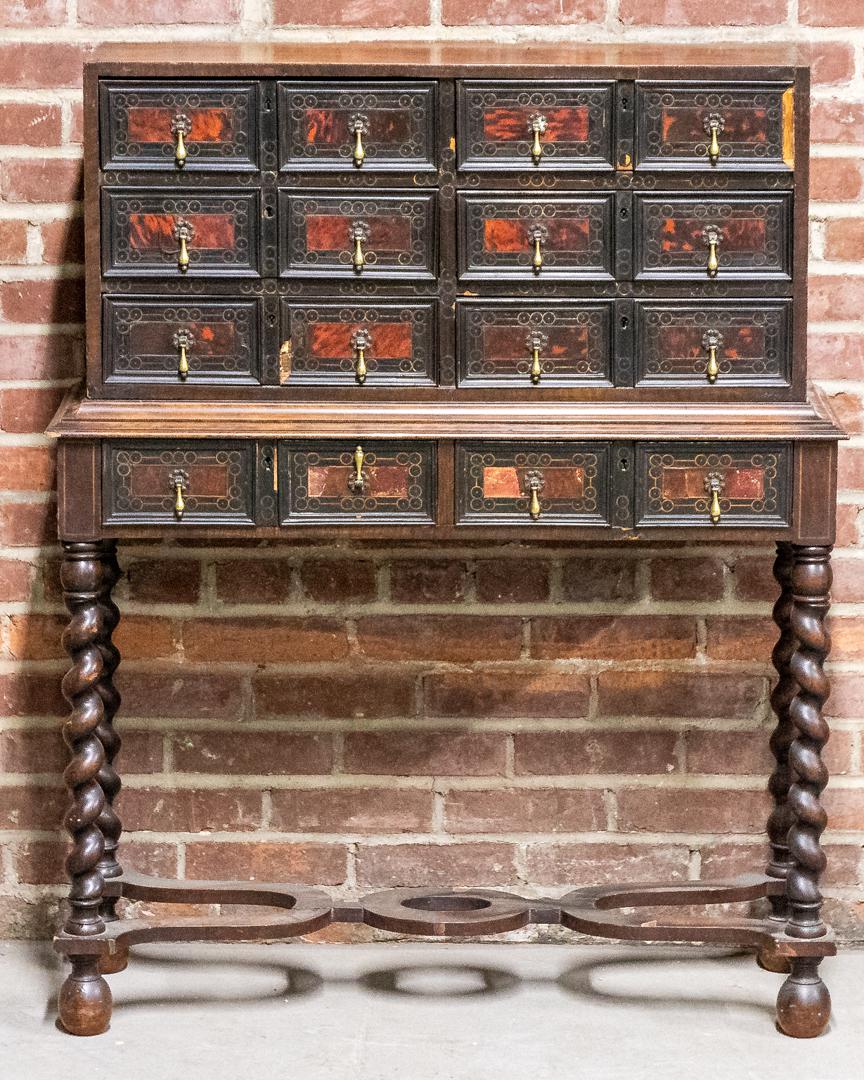 Late 18th to Early 19th Century Baroque Period Ebonized Fruitwood Tortoise Shell and Bone Specimen: Circa late 18th to early 19th century Baroque period fruitwood, tortoise shell, and bone specimen cabinet in an ebonized finish. The piece features metal drop shaped pulls on the drawer fronts framed 