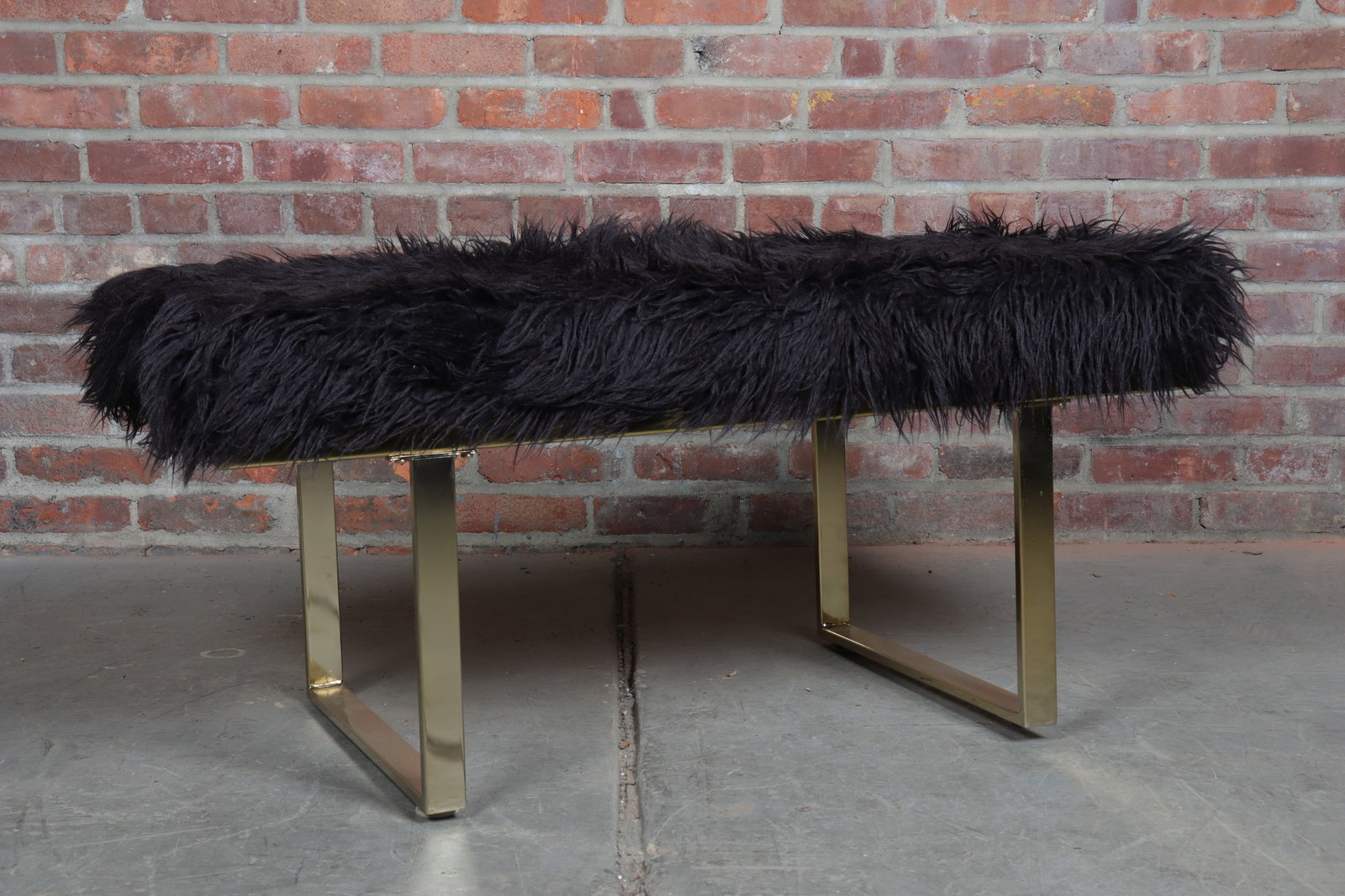 Modern Faux Sheepskin Bench: Modern bench with faux sheepskin and gold upholstered legs.