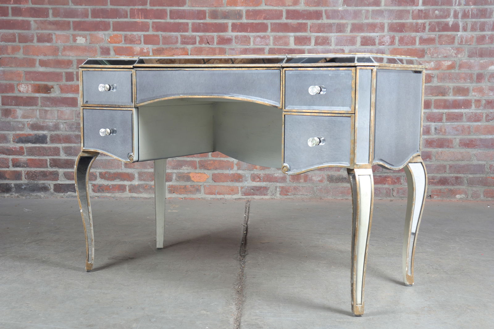 1950's Style Mirrored Flip-Top Vanity: Contemporary 1950's style fully mirrored flip-top vanity. Cream and gold cabriole legs. Single deep drawer with double-faux front to the right, two true drawers to the left and mirrored front apron. C