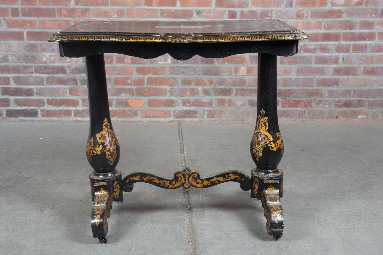 Papierp-Mâché Inlaid Mother of Pearl Table: Papier-mâché table with mother of pearl inlay. The top with a hand painted nocturn scene and a mother of pearl inlaid depiction of a castle. Mother of pearl floral marquetry borders along a Greek ke