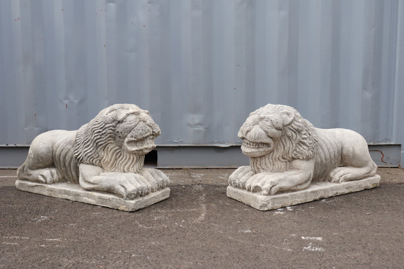 Pair of Byzantine Style Cement Lion Sculptures: Byzantine style lion sculptures in grotesque form. In cement on rectangular bases.
