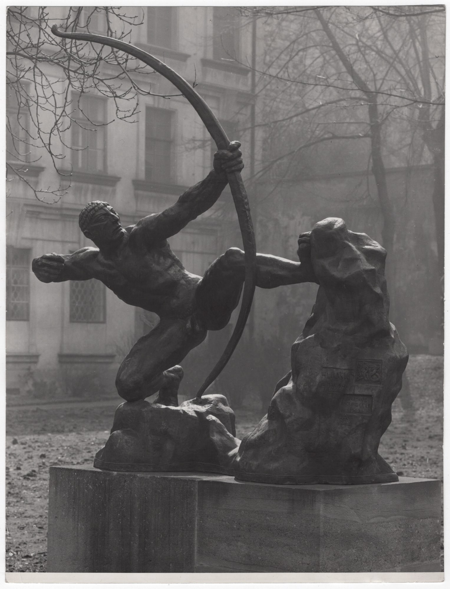 Tibor Honty* (Krombach 1907 - 1968 Prague): Tibor Honty* (Krombach 1907 - 1968 Prague) Sculpture by Antoine Bourdelle, Herakles in the garden of Palais Sternberg, Prague, around 1955 vintage gelatin silver print 23,5 x 18 cm verso
