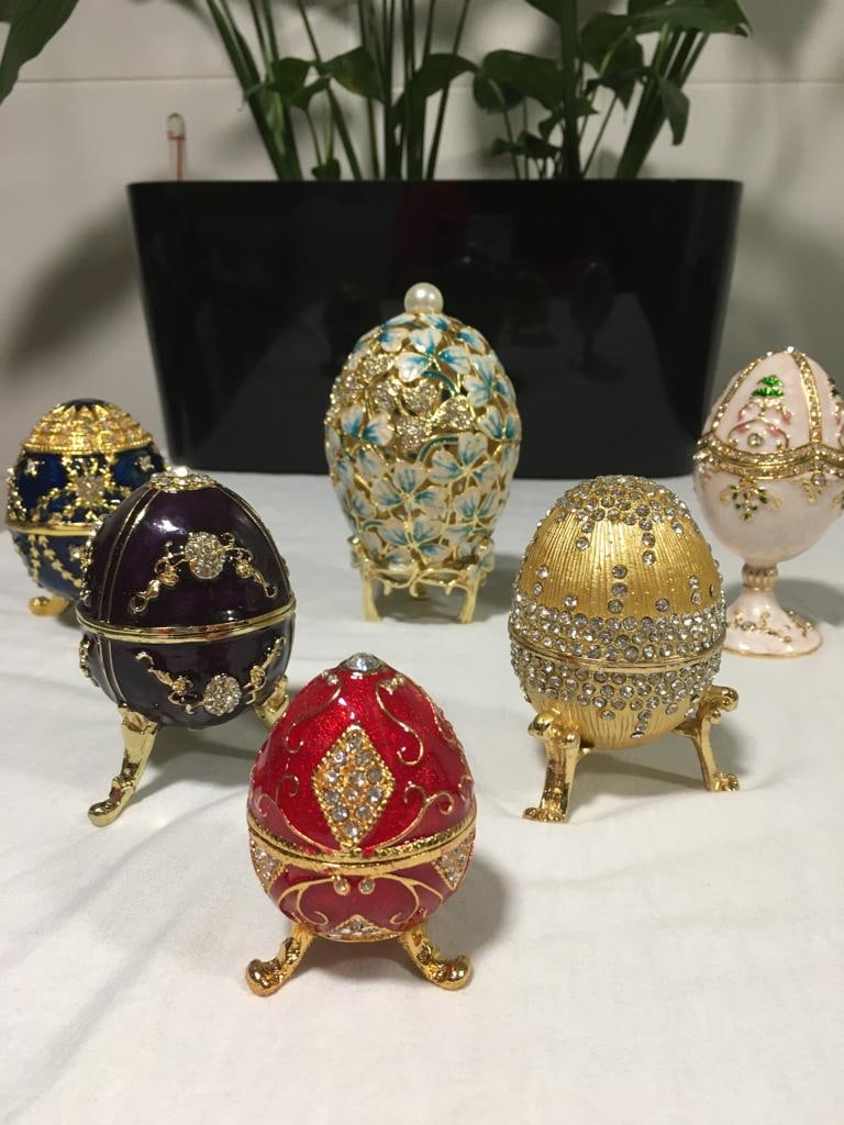 SIX (06) ROYAL JEWELS INSPIRED BY RUSSIAN-MADE FABERGE EGGS: Description: These Six spectacular eggs are of different sizes and the colors are fantastic, all beads with glassware and beautiful stones, also have golden trim, they are enameled, they are made by h