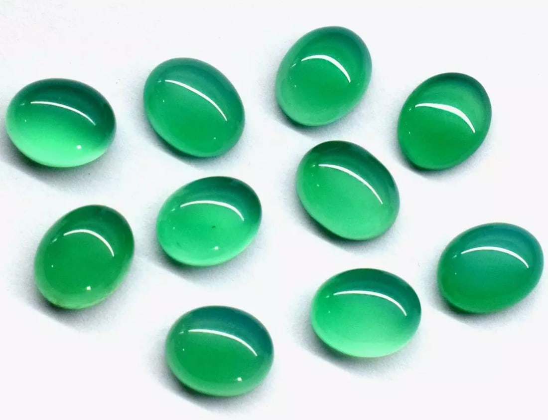 (10 PIECES) NATURAL GREEN ONYX CABOCHONS OVAL 8.5X11 MM LOOSE GEMSTONE: These are natural, earth mined and hand crafted with precision. Stone: Green Onyx, Stone Shape: Cabochons Oval, Stone Size: 8.5x11 mm, Width - 5 - 6 mm, Weight: approx. 40 carats. The photographs are 