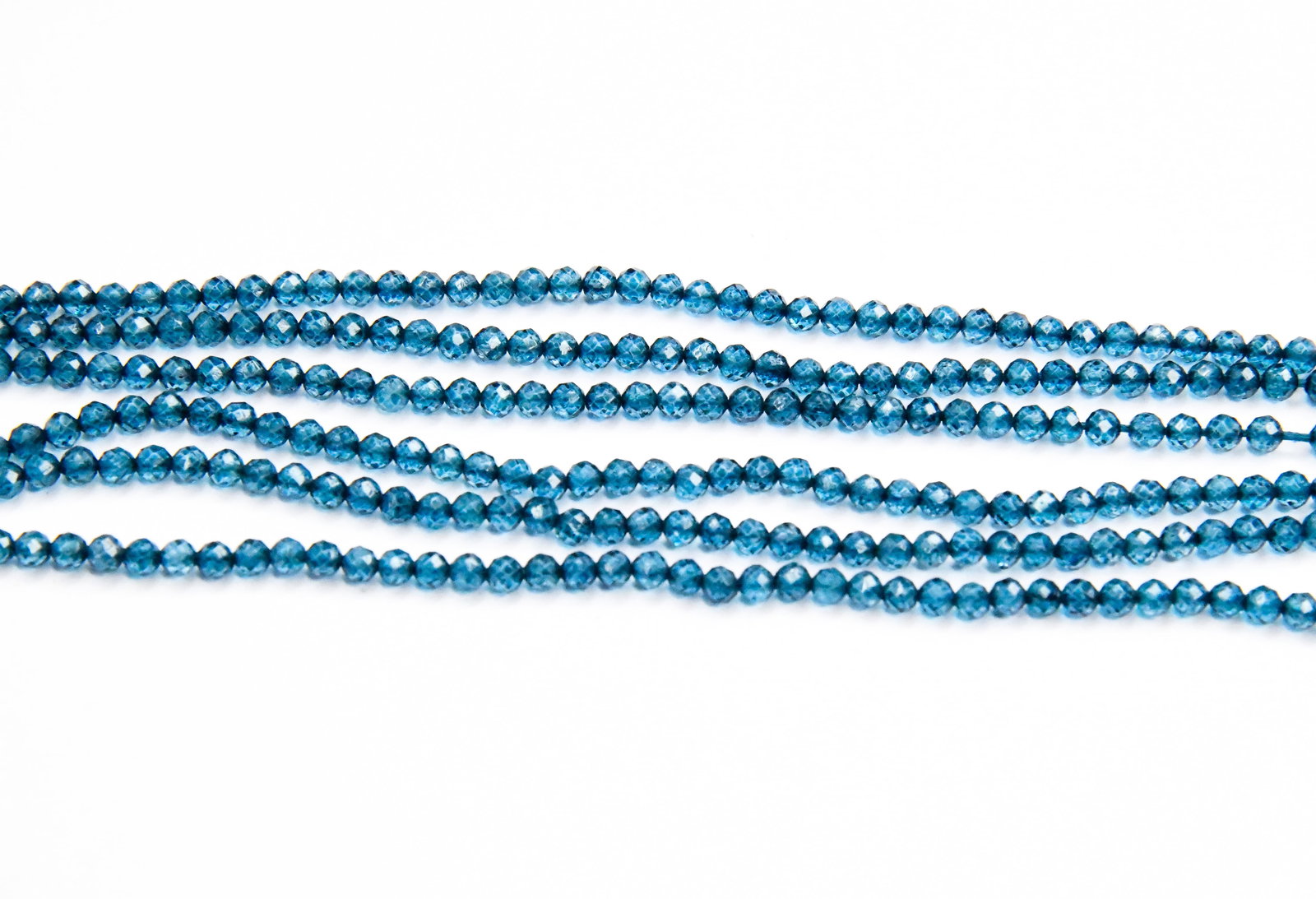 12" STRAND NATURAL LONDON BLUE TOPAZ BEADS (COATED) FACETED ROUND 3.5 MM (3 LINES): These are natural, earth mined and hand crafted with precision. Stone: London Blue Topaz (Coated), Stone Shape: Faceted Round, Stone Size: 3.5 mm, Length: 12", Weight: approx. 31.33 carats. The photog