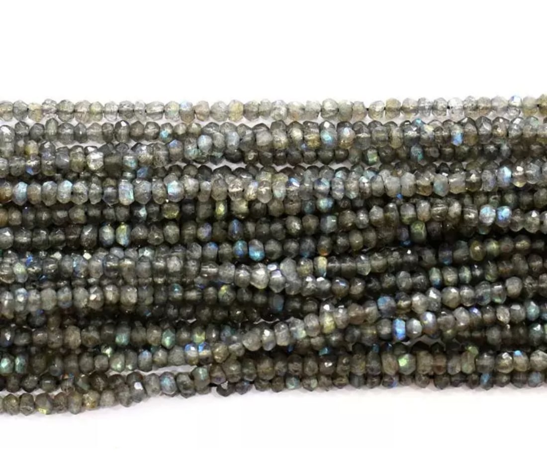 12.5" STRAND NATURAL LABRADORITE BEADS FACETED RONDELLE 3.5 - 4 MM 1 LINE: These are natural, earth mined and hand crafted with precision. Stone: Labradorite, Shape: Faceted Rondelle, Size: 3.5 - 4mm, Width - 1.5 - 2mm, Length: 12.5" line, Weight: approx. 31.70 carats. The p