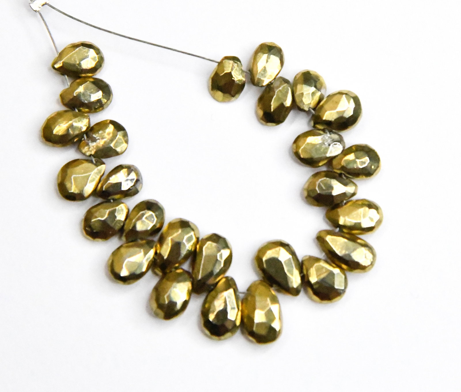 NATURAL PYRITE BEADS FACETED PEAR 4x7 - 5x9 MM 26 PCS: These are natural, earth mined and hand crafted with precision. Stone: Pyrite, Stone Shape: Faceted Pear, Stone Size: 4.5x7 - 5.5x9 mm, Width: 2.5 - 3 mm, Weight: approx. 40 carats. The photographs ar